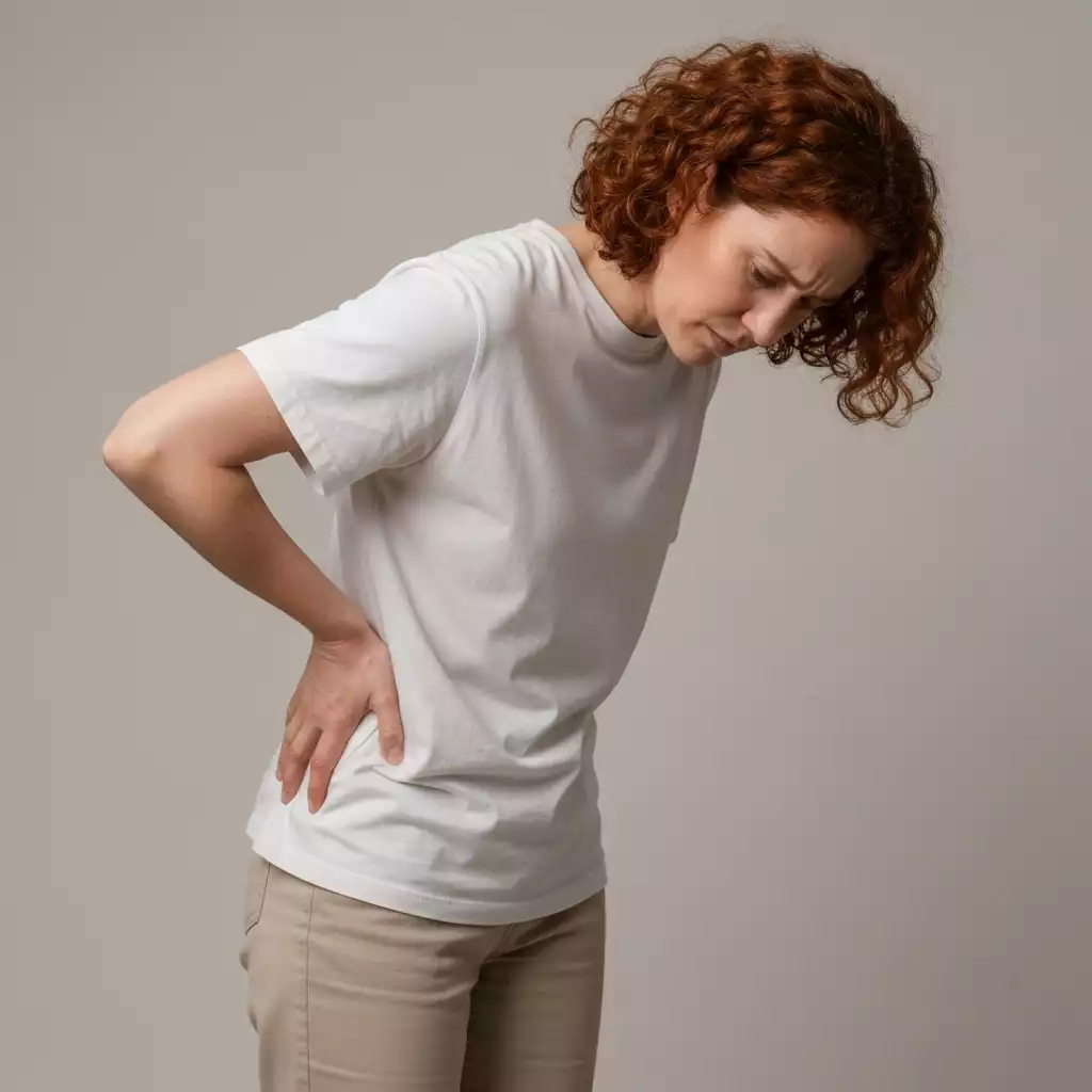 Person experiencing lower back pain, highlighting sciatica symptoms
